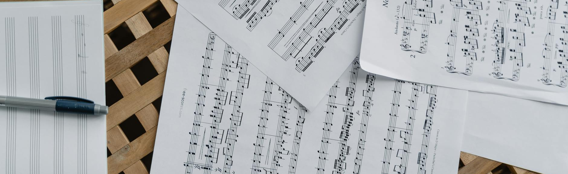 sheet music on wooden surface